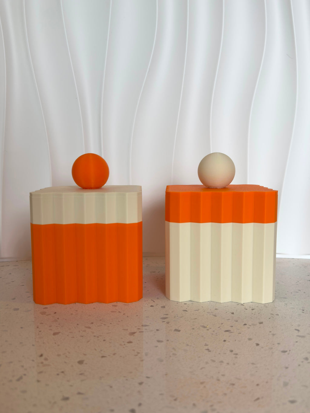 Pantry Collection canisters showing orange and cream color-blocked design