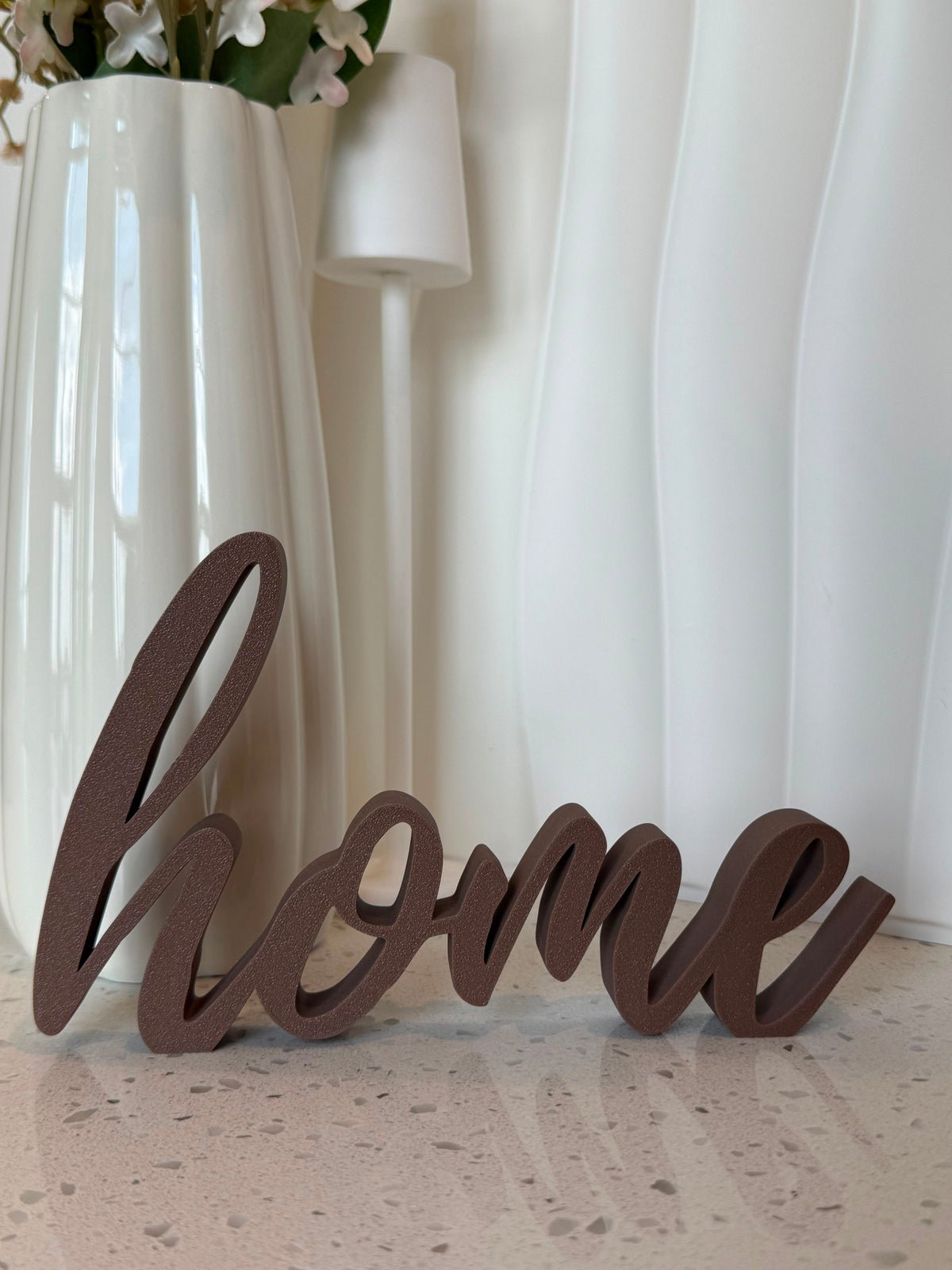 Brown cursive home script sign