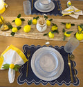 Secret Garden table setting - navy placemat with lemon centerpiece