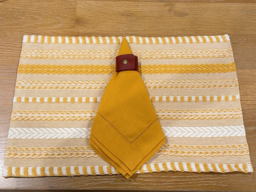 Cozy Gathering Table Setting - mustard napkin, woven placemat, burgundy leather ring