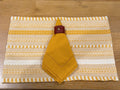 Cozy Gathering Table Setting - mustard napkin, woven placemat, burgundy leather ring