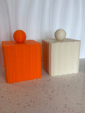 Pantry Collection orange and cream fluted canisters with ball lids