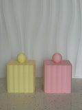 Ripple Canister yellow and pink fluted canisters with ball lids