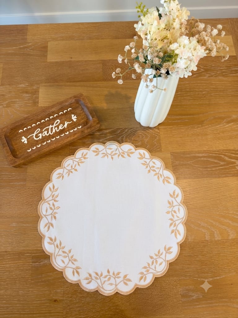 Whispering Leaves embroidered scalloped placemat with leaf-vine detailing